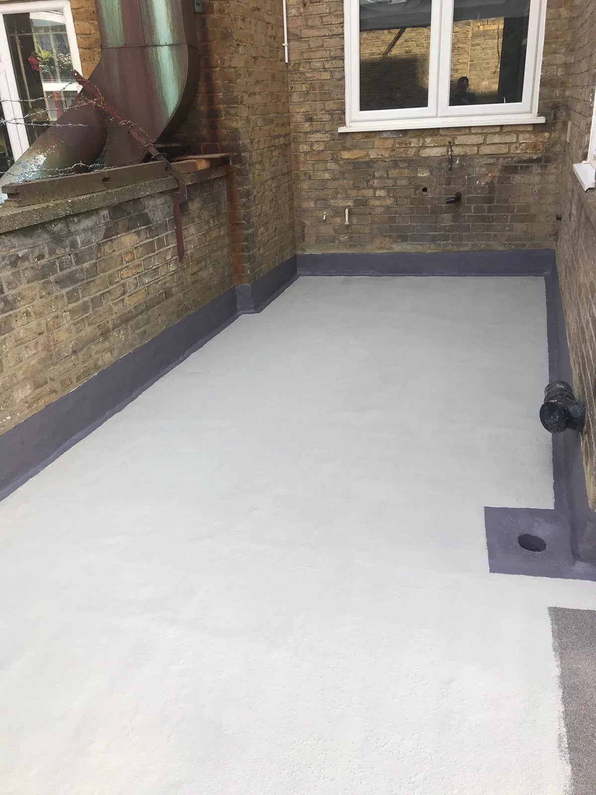 FLEXITEC liquid roofing system installed on a completed roof